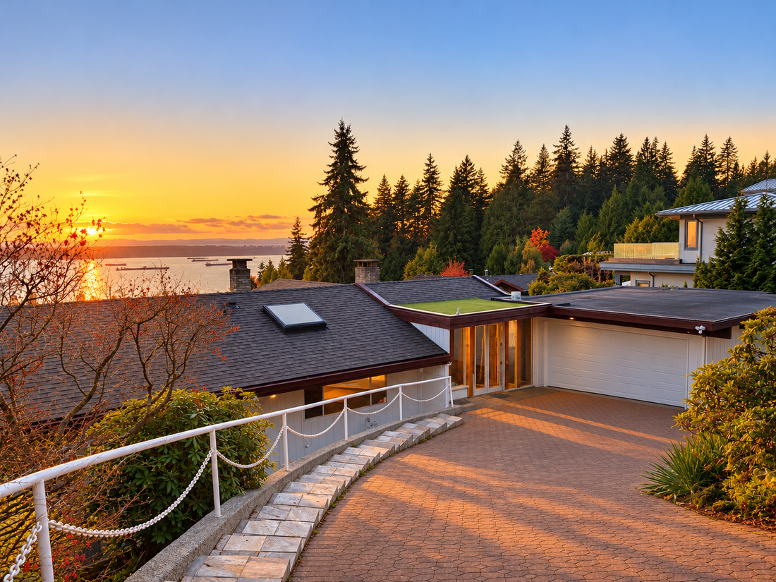 Completed West Vancouver residence at sunset with a white Pro Tech 2500 garage door beside the entrance