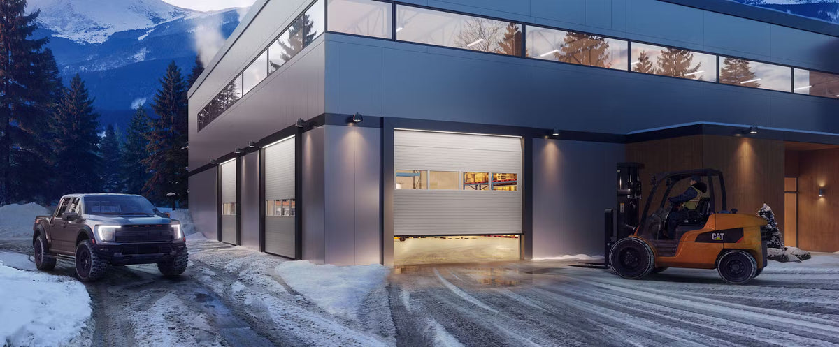 Commercial sectional overhead door with full-view glazing at a large building opening