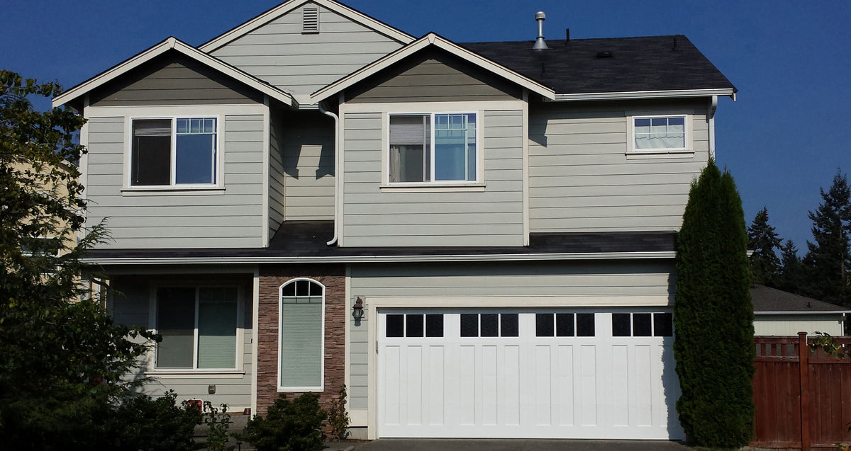 White carriage house garage door with panel overlays