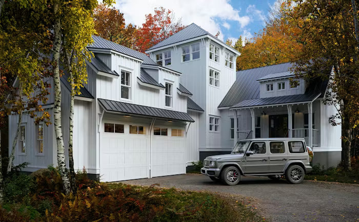 Carriage style garage door with window and hardware details