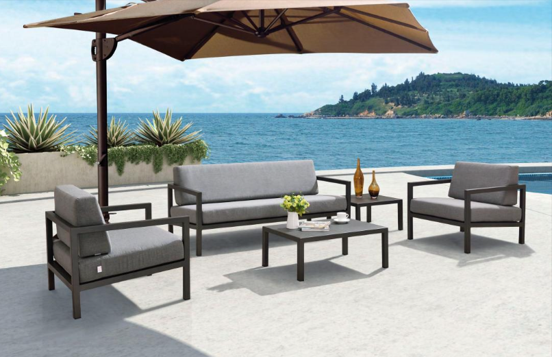 Luxury patio lounge set with UV-protected fabric and minimalist aluminum frames.
